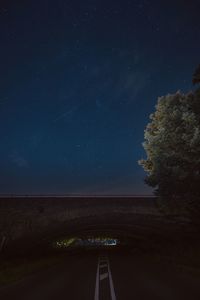 Road against sky at night