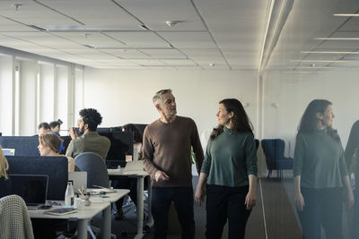 Two professionals discussing in office