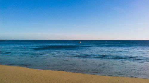 Scenic view of sea against clear sky