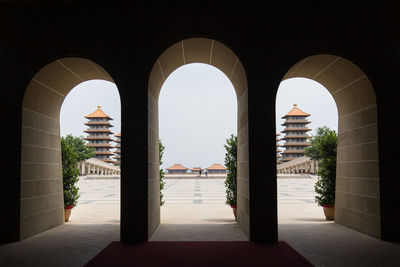 Entrance of historic building against clear sky