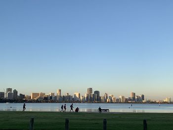 Panoramic view of sea and buildings against clear sky