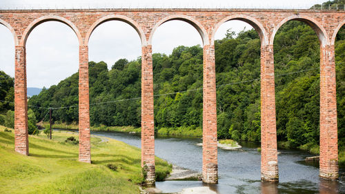 Arch bridge over river