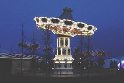 Low angle view of illuminated lights at night