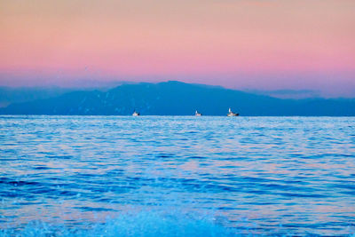 Scenic view of sea against sky during sunrise