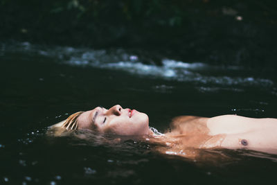 Close-up of woman swimming in water