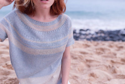 Close-up of woman standing on beach