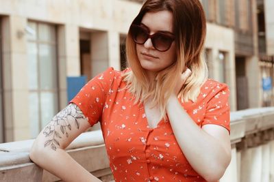 Portrait of young woman with sunglasses