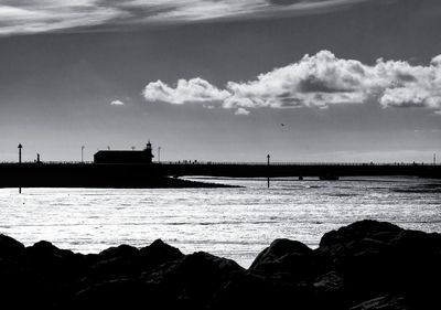 Scenic view of sea against cloudy sky