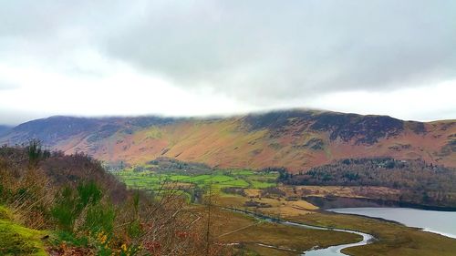 Scenic view of landscape against sky during autumn