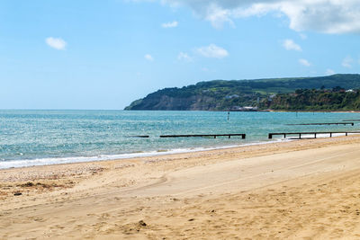 Scenic view of sea against blue sky