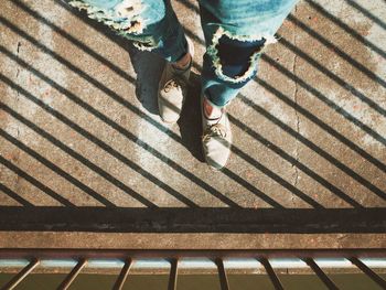 Low section of woman on tiled floor