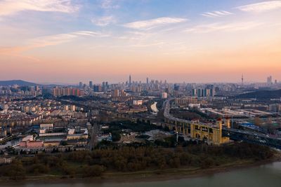 High angle view of buildings against sky during sunset