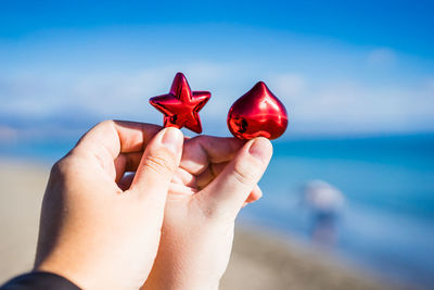 Close-up of couple holding heart shape and star shape