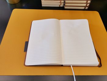 High angle view of open book on table