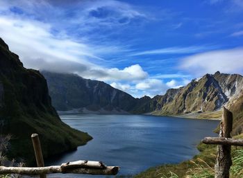 Scenic view of lake and mountains against sky. volcano crater with water