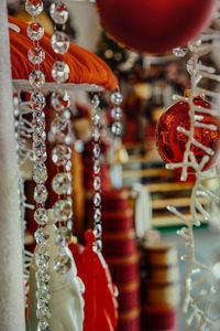 Close-up of decoration hanging on glass for sale