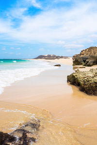 Scenic view of beach against sky