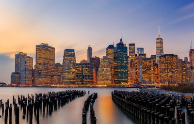 Modern buildings in city at sunset