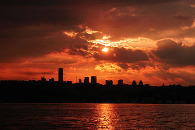 Silhouette buildings against sky during sunset in istanbul