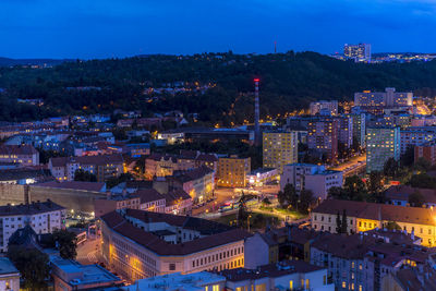 High angle view of illuminated buildings in city at night