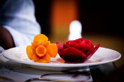 Close-up of fruits in plate on table