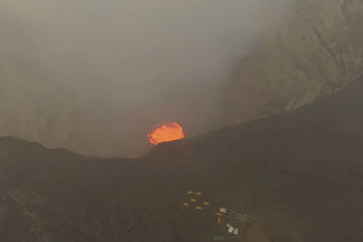 Scenic view of volcanic mountain against sky