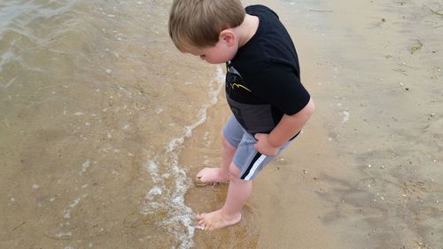 High angle view of boy on beach