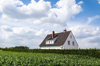 House on field against sky