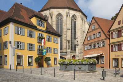 Residential buildings against sky in city