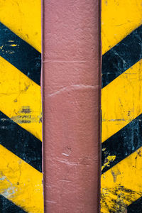 Detail shot of yellow painted wall