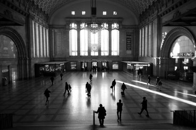 People walking in railroad station