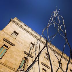 Low angle view of building against blue sky