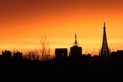Silhouette buildings at sunset