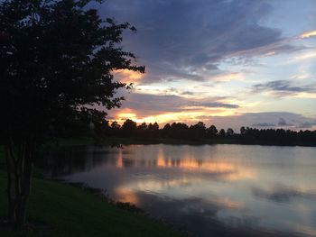 Scenic view of lake at sunset