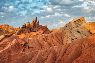 Rock formations in desert against sky