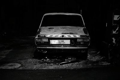 Abandoned car at night