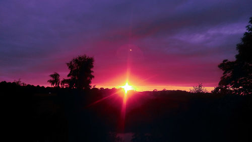 Scenic view of silhouette trees against sky during sunset