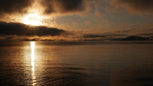 Scenic view of sea against sky during sunset