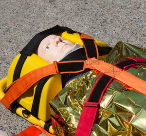 Portrait of cute boy lying down toy