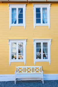 House with a bench at the wall at house in norway