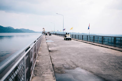 Pier over sea against sky