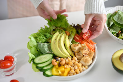 Midsection of woman holding food