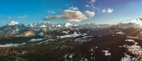 Scenic view of snowcapped mountains against sky