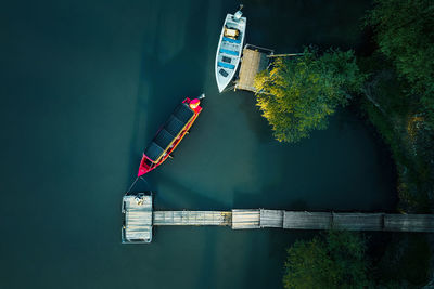 Aerial view of fishing boat by pier