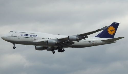 Low angle view of airplane against sky