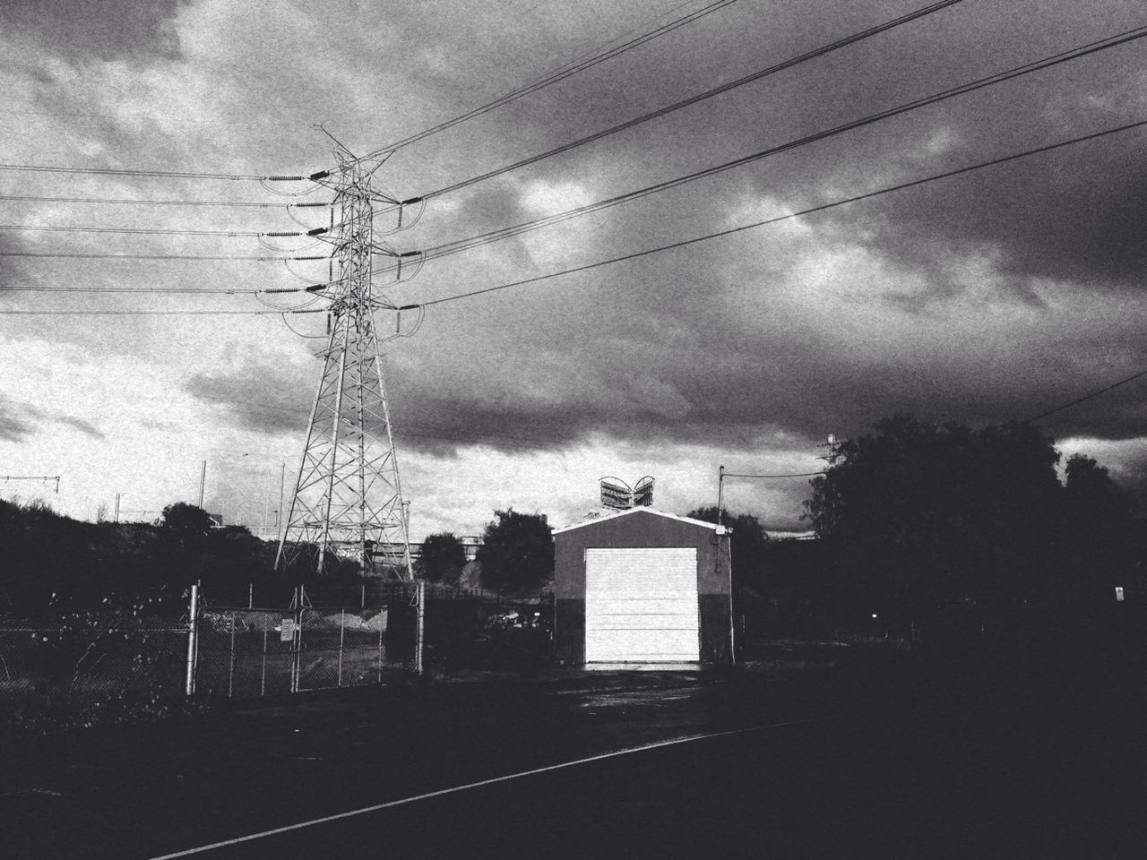 power line, sky, electricity pylon, electricity, cloud - sky, cable, power supply, silhouette, built structure, cloudy, architecture, transportation, railroad track, connection, building exterior, weather, dusk, power cable, tree, fuel and power generation