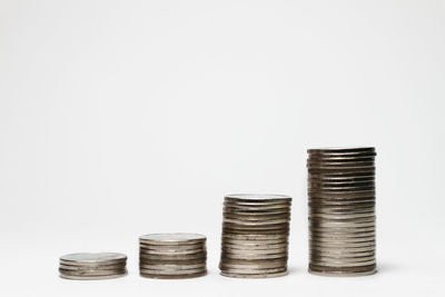 Close-up of stack of objects over white background