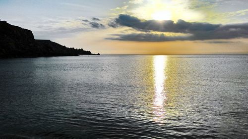 Scenic view of sea at sunset