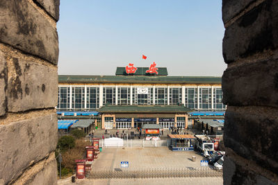 Buildings in city against clear sky