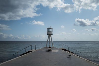 Pier over sea against sky